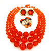 West Germany Orange Beaded Necklace With Enameled Brooch and Sarah Coventry Earrings at bitchinretro.com