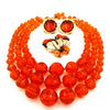 West Germany Orange Beaded Necklace With Enameled Brooch and Sarah Coventry Earrings at bitchinretro.com
